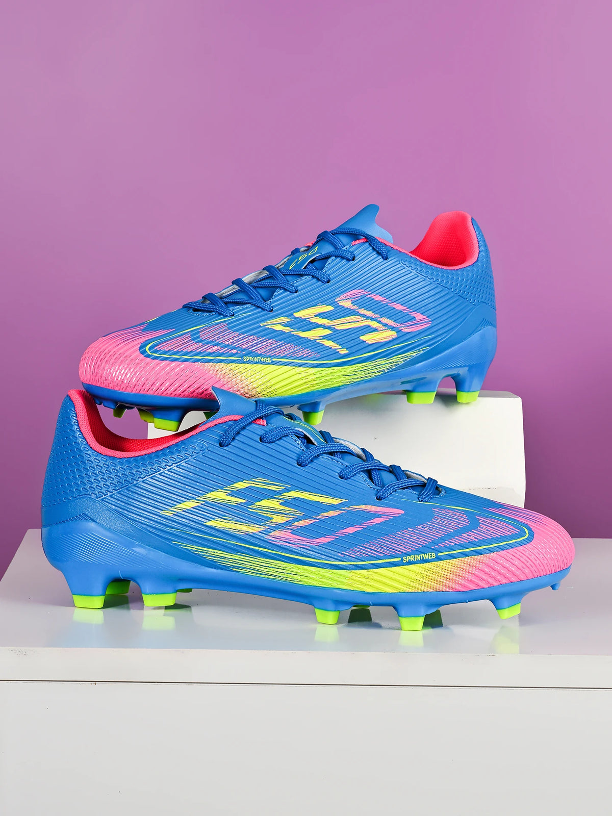 Chaussures de football AG/FG économiques avec tige en PU mélangé, crampons longs en TPU, antidérapantes et durables pour terrain en herbe